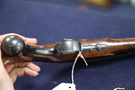 A pair of early 19th century percussion lock pistols, by Wogdon of London, 14in.
